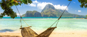 Traditional braided hammock in the shade on a tropical island